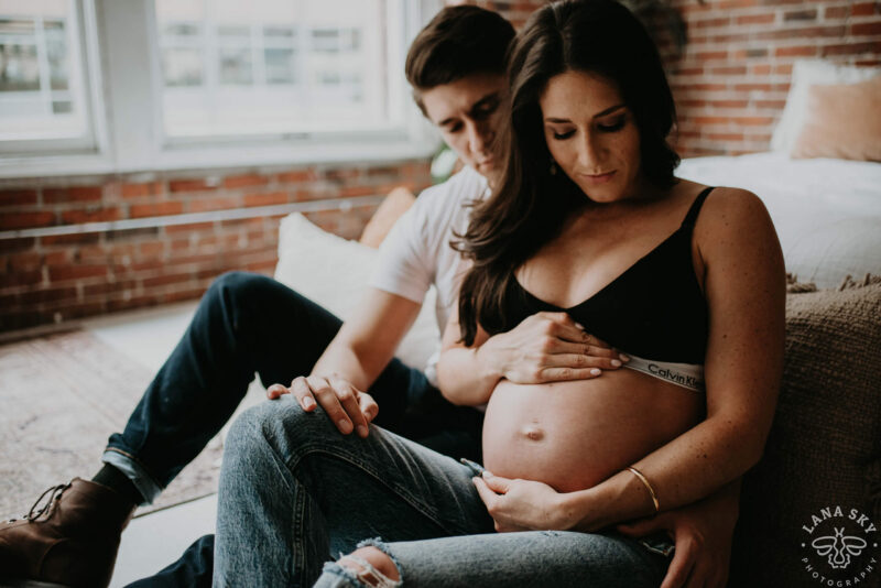 A Couple Posing Outside at a Pregnancy Photoshoot · Free Stock Photo