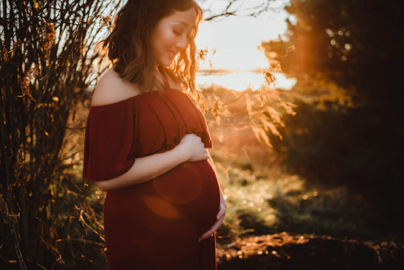 Stunning Red Dress for Winter Maternity Photos