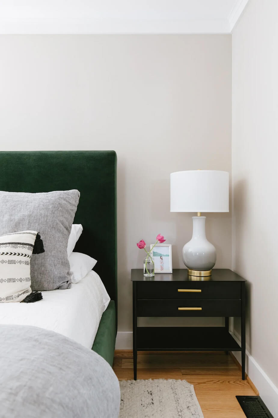 Maternity photo in a beautiful frame on a nightstand in a bedroom