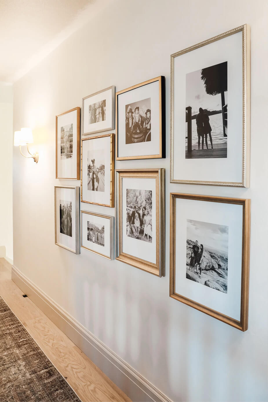 A display of family photos along a hallway