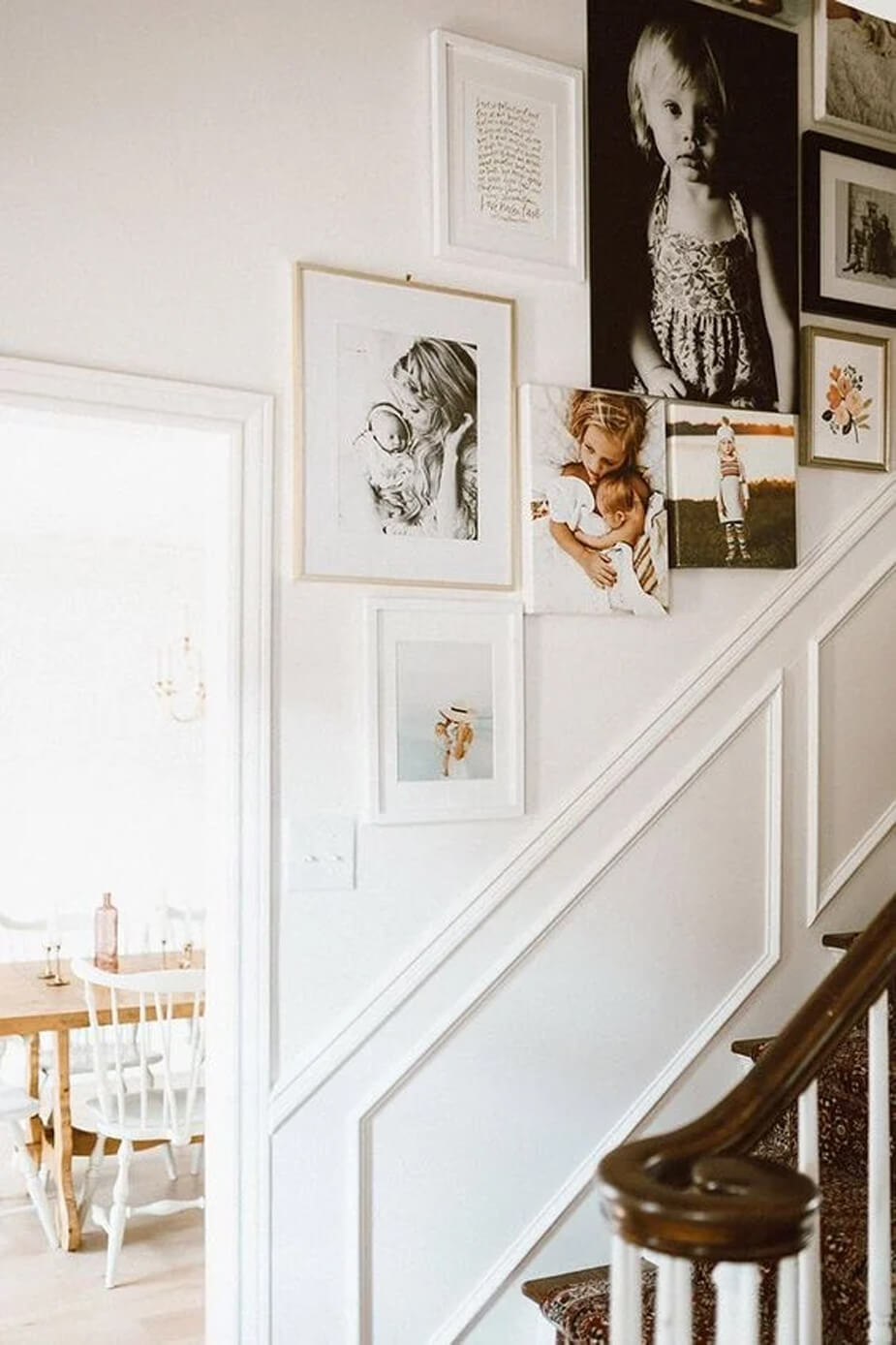 A display of family photos along a staircase